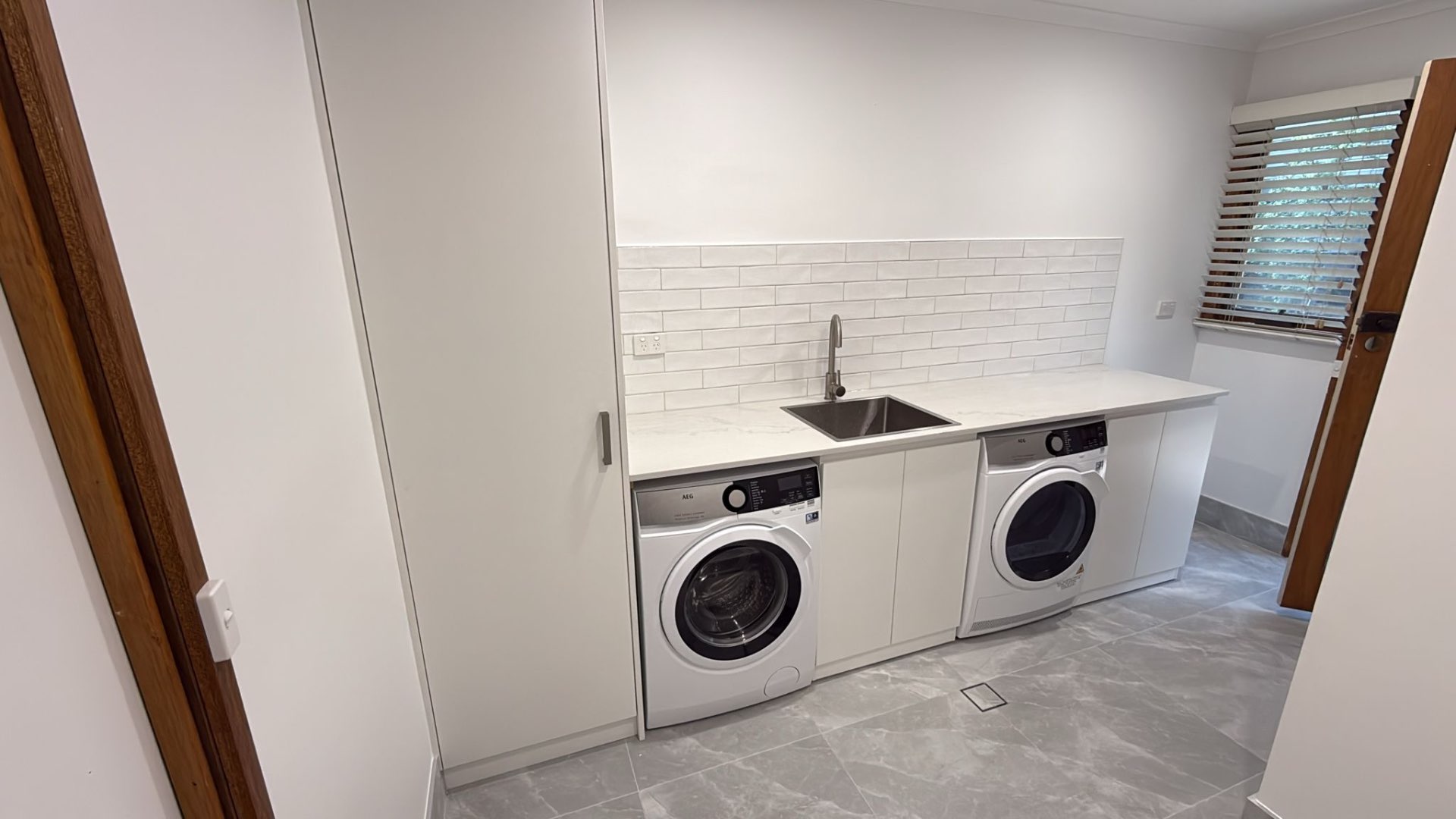 Laundry fit-out with new sink, tapware and appliance plumbing by Endeavour Plumbing Group