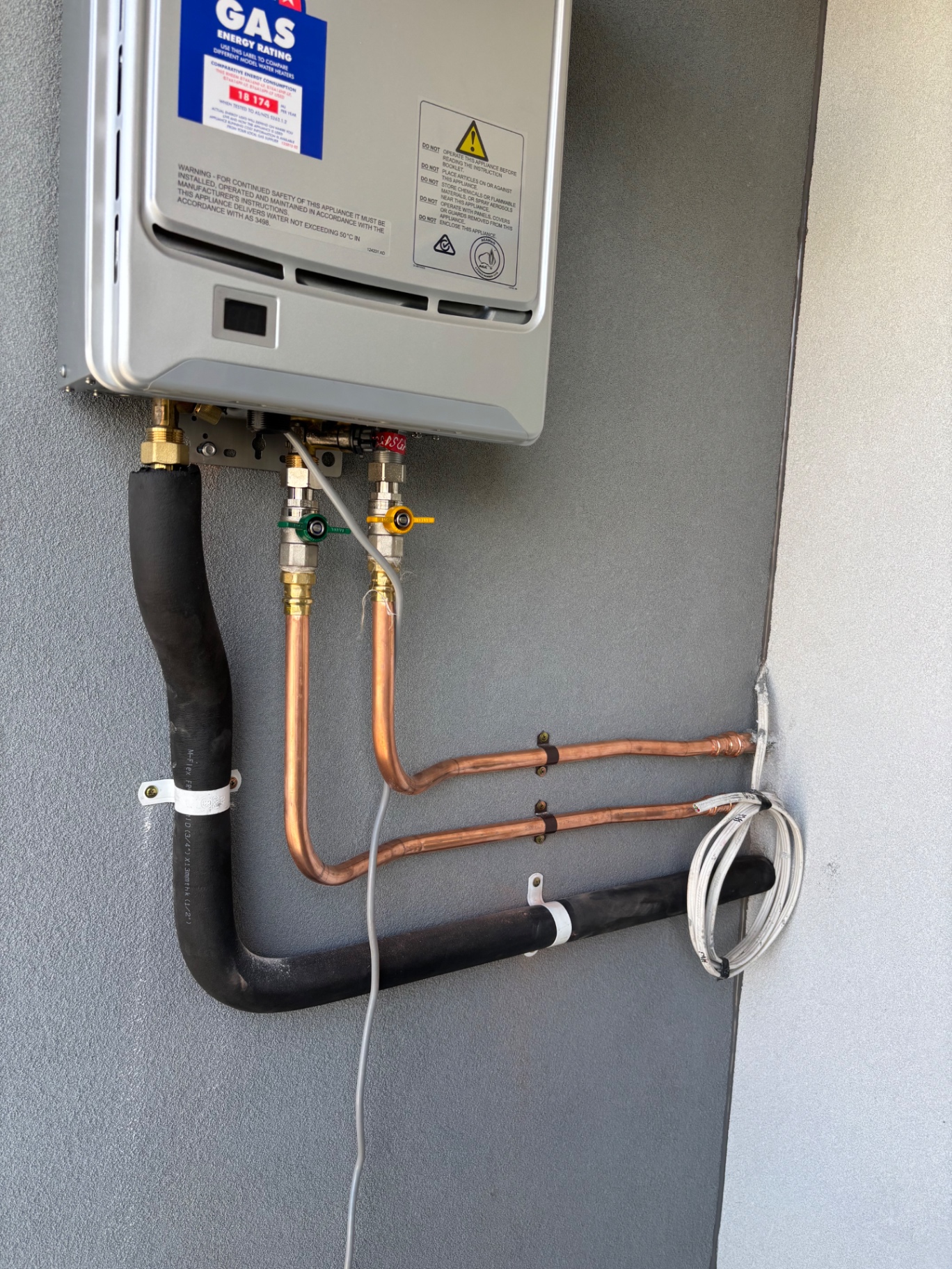 Gas continuous-flow hot water unit with new copper pipework installed by Endeavour Plumbing Group